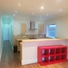 Photo 4: Kitchen area onto corridor