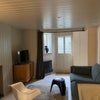 Photo 2: The living area and front entrance