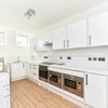 Photo 6: Downstairs Kitchen 
