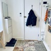 Photo 3: Wall mounted shoe storage and hooks for outdoor coats