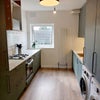 Photo 4: finishing touches being added to kitchen