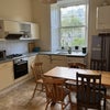 Photo 5: kitchen/ diner ( with washing machine and walk in food cupboard with large fridge freezer)