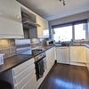 Photo 5: Modern kitchen with plenty of cupboards and separate utility room