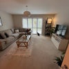 Photo 5: Living area - dining table with 4 seats not pictured 