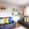 Photo 8: Comfy living room perfect for relaxing after a hard days work