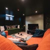 Photo 6: Basement cinema lounge