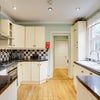 Photo 4: The kitchen comes fully equipped and the dining table comes with new chairs.  