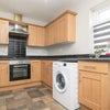Photo 4: Kitchen. There is a fridge freezer where the white square is.