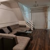 Photo 4: Living room with 7-seater sofa and TV