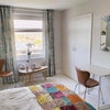 Photo 3: Room showing optional desk before sofa added