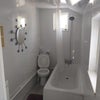 Photo 4: Downstairs bath/toilet 