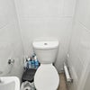 Photo 8: Downstairs toilet and shower