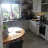 Photo 1: Kitchen with half moon breakfast table