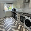 Photo 2: Kitchen Front