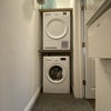 Photo 18: Separate utility with washing machine and tumble dryer
