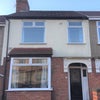 Photo 2: Front of Property