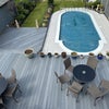 Photo 8: Decking area and heated pool 
