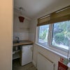 Photo 3: The kitchen area has a microwave/oven/airfryer and Fridge/freezer