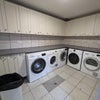 Photo 7: There is a separate laundry room shared with the main house