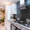 Photo 11: Communal Kitchen and Living Area