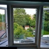 Photo 4: View of garden. Window has blackout blind, and curtains. 