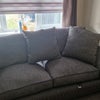 Photo 2: The sofa which is opposite the TV in the living room.