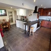 Photo 3: There is a large kitchen with locked cupboard