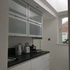 Photo 6: Kitchen with Skylight and window facing courtyard