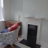 Photo 2: The room showing fireplace