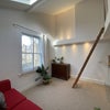 Photo 1: Main living space with mezzanine bedroom
