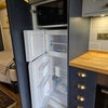 Photo 4: Fridge freezer and microwave