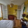 Photo 3: Storage space at back of room