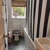 Photo 4: Shared bathroom with shower over bath