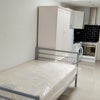 Photo 1: small double bed in studio flat