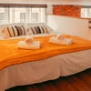 Photo 6: Mezannine kingsize bed with windows
