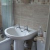 Photo 3: Shared bathroom with bath and shower over