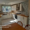 Photo 2: Kitchen with gas hobs, oven, dishwasher, fridge, microwave oven, dining table.