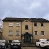 Photo 5: Detached flat complex with parking. 