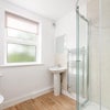 Photo 5: 1 of the 2 large shared bathrooms