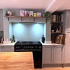 Photo 5: The kitchen and living area - big enough for everyone to cook