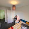 Photo 5: Bedroom with wardrobe and storage