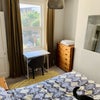 Photo 3: The room! The furniture has since been painted white, and there’s a new comfy chair