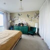 Photo 7: View from the bedroom door, the wardrobes are hidden behind the curtain