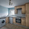 Photo 8: Kitchen with washing machine, dishwasher, fridge and oven/hob