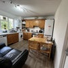 Photo 3: Kitchen with tumble dryer tall fridge & freezer plenty if cupboard space 