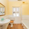 Photo 8: We are adding an over bath shower in here