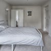 Photo 3: Double Room - work desk, dressing table, bed and storage