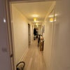 Photo 2: Hallway seen from opposite to entrance door 