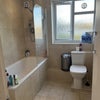 Photo 5: Spacious bathroom with power shower over the bath and sink with above/below vanity