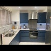 Photo 2: Kitchen with hidden washing machine 